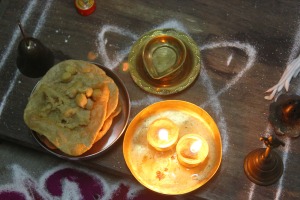 Prasadam during Ashtami puja - poori, channa and halwa, lamps for aarti
